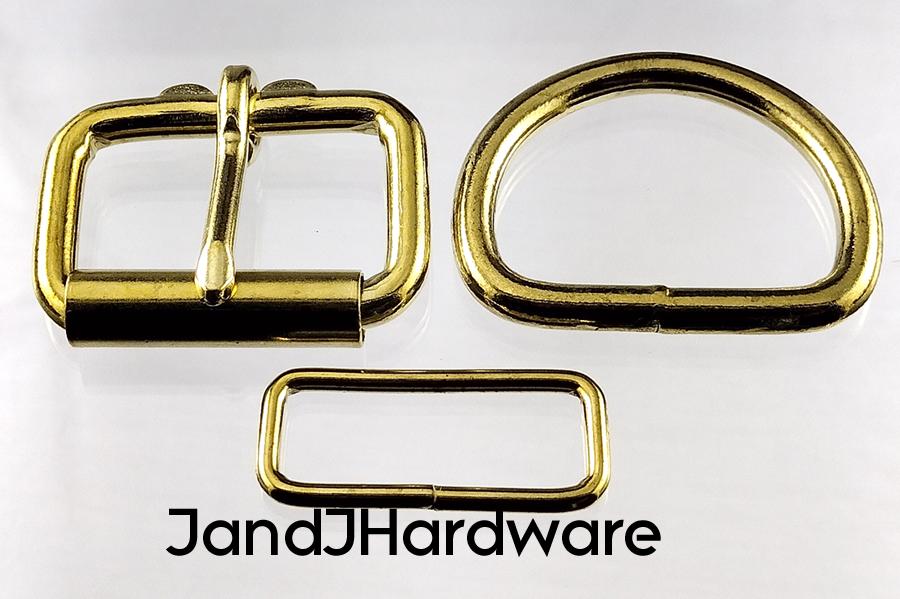 1 1/2 inch brass plated maker pack consisting of 2 each of a heel bar roller buckle, D ring and a belt keeper.