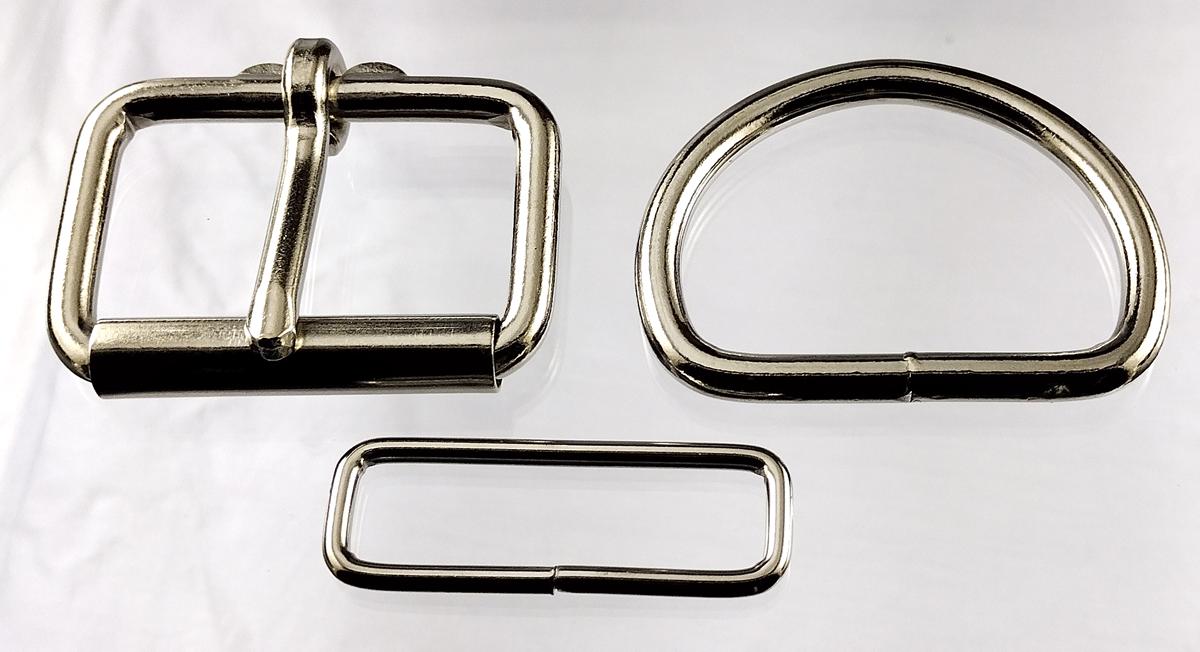 2 inch nickel plated maker pack consisting of 2 each of a heel bar roller buckle, D ring, and a belt keeper.