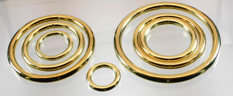 An image of a group of brass plated O-rings ranging in size from 3/4 inch to 3 inch.